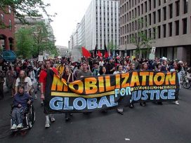 Protester with a banner saying 