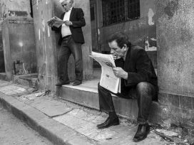 Algerian men reading newspapers