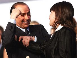 Berlusconi talking to a woman