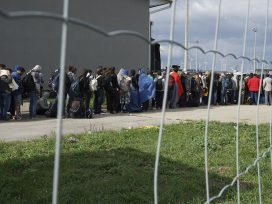 A_line_of_Syrian_refugees_crossing_the_border_of_Hungary_and_Austria_on_their_way_to_Germany._Hungary_Central_Europe_6_September_2015